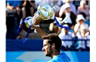 EASTBOURNE, ENGLAND - JUNE 21:  Feliciano Lopez of Spain celebrates with the trophy after winning the Men's Final between Richard Gasquet of France and Feliciano Lopez of Spain at the Aegon International at Devonshire Park on June 21, 2014 in Eastbourne, England.  (Photo by Ben Hoskins/Getty Images)